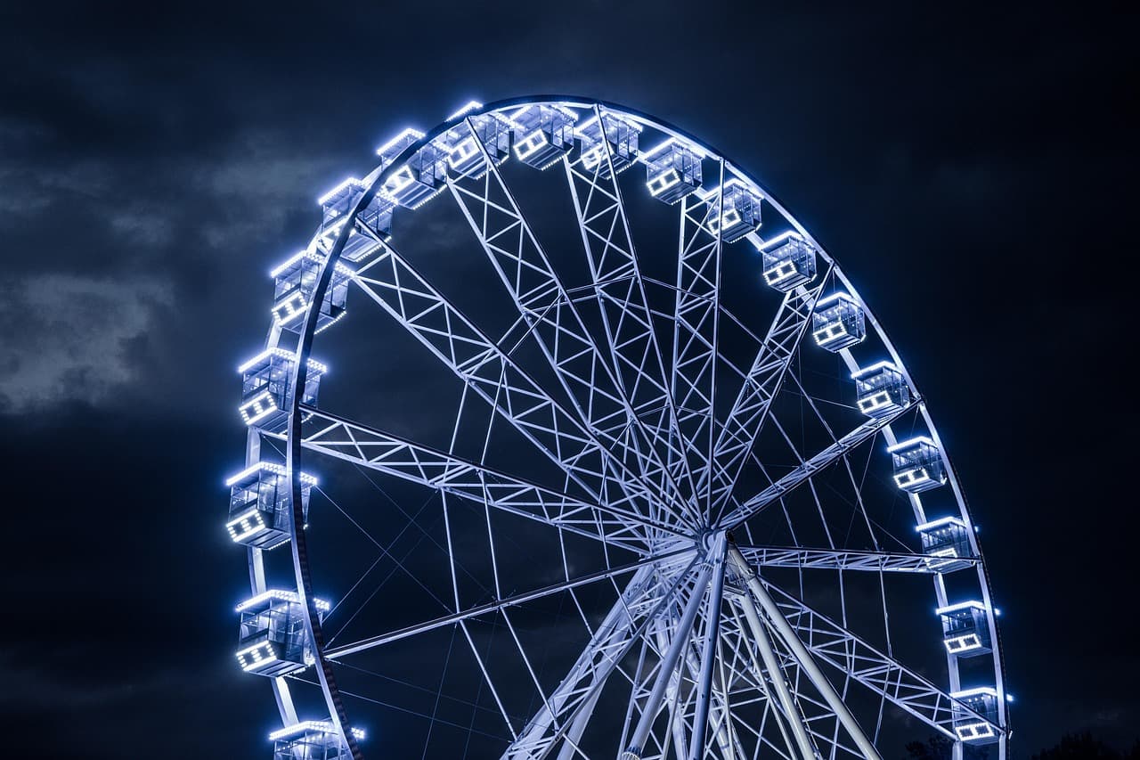 Ferris wheel lit up at night
